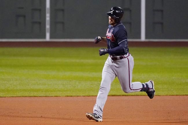 Atlanta Braves' Adam Duvall smiles as he rounds the bases, on his third home run of the game, during the eighth inning of a baseball game against the Boston Red Sox, Wednesday Sept. 2, 2020, in Boston. (AP Photo/Charles Krupa)