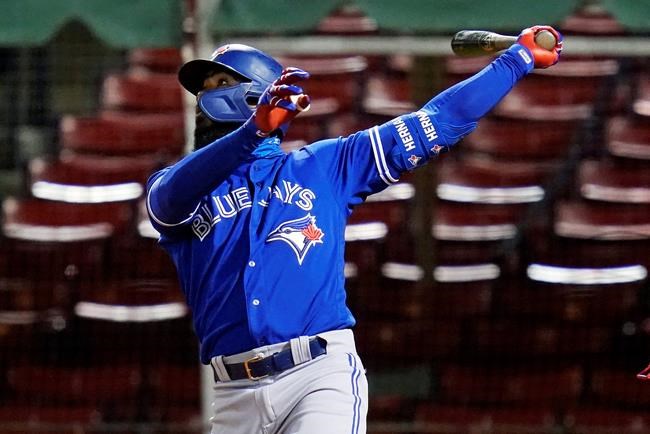 Toronto Blue Jays' Teoscar Hernandez watches his three-run home run that broke a 2-2 tie during the 10th inning of the team's baseball game against the Boston Red Sox, Thursday Sept. 3, 2020, in Boston. (AP Photo/Charles Krupa)