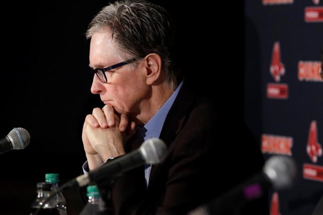 Boston Red Sox baseball team owner John Henry listens during a news conference at Fenway Park, Wednesday, Jan. 15, 2020, in Boston. The Boston Red Sox have parted ways with manager Alex Cora, with the move coming one day after baseball Commissioner Rob Manfred named him as a ringleader with Houston in the sport's sign-stealing scandal. (AP Photo/Elise Amendola)