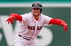Boston Red Sox's Christian Arroyo celebrates his RBI double in the fifth inning of a baseball game against the Tampa Bay Rays at Fenway Park, Wednesday, April 7, 2021, in Boston. (AP Photo/Elise Amendola)