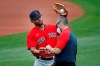Boston Red Sox's Xander Bogaerts receives treatment on his hand during baseball training camp at Fenway Park, Monday, July 6, 2020, in Boston. (AP Photo/Elise Amendola)