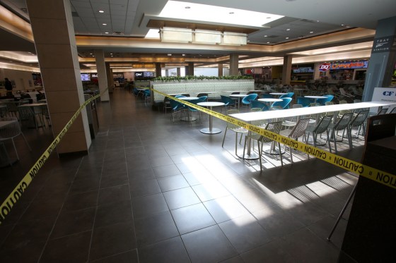 SHANNON VANRAES / WINNIPEG FREE PRESSTables and chairs at CF Polo Park's food court are wrapped in caution tape amid concerns of COVID-19 on Wednesday.