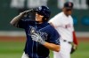 Tampa Bay Rays' Willy Adames salutes as he rounds third base on his solo home run during the second inning of a baseball game against the Boston Red Sox, Wednesday, Aug. 12, 2020, in Boston. (AP Photo/Michael Dwyer)