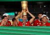 Munich's Thomas Mueller celebrates with the trophy after winning the DFB Cup final match between Bayer 04 Leverkusen and FC Bayern Muenchen at Olympiastadion in Berlin, Germany, Saturday, July 4, 2020. (Photo by Alexander Hassenstein/Pool via AP)
