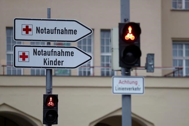 Signposts stand in front main entrance of hospital 'Klinikum Schwabing' in Munich, Germany, Tuesday, Jan. 28, 2020. Germany has declared its first confirmed case of the deadly coronavirus that broke out in China. (AP Photo/Matthias Schrader)