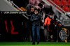 Leverkusen's head coach Peter Bosz instructs his players during the Europa League Group C soccer match between Bayer Leverkusen 04 and Slavia Prague at the BayArena in Leverkusen, Germany, Thursday, Dec. 10, 2020. (AP Photo/Ina Fassbender, Pool)