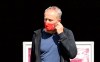 Freiburg coach Christian Streich wears a face mask as he arrives for the German Bundesliga soccer match between RB Leipzig and SC Freiburg in Leipzig, Germany, Saturday, May 16, 2020. The German Bundesliga becomes the world's first major soccer league to resume after a two-month suspension because of the coronavirus pandemic. (Jan Woitas/dpa via AP)