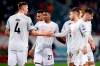 Bayern's Niklas Suele, from left, David Alaba and Lucas Hernandez celebrate after the Champions League group A soccer match between Lokomotiv Moscow and Bayern Munich in Moscow, Russia, Tuesday, Oct. 27, 2020. (Maxim Shemetov/Pool via AP)