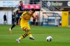Jadon Sancho of Borussia Dortmund scores his teams sixth goal during the German Bundesliga soccer match between SC Paderborn 07 and Borussia Dortmund at Benteler Arena in Paderborn, Germany, Sunday, May 31, 2020. Because of the coronavirus outbreak all soccer matches of the German Bundesliga take place without spectators. (Lars Baron/Pool via AP)