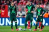 Wolfsburg's Maximilian Arnold, from left, Daniel Ginczek and Renato Steffen stand on the pitch after Union's Sebastian Andersson scored his side's opening goal during the German Bundesliga soccer match between 1. FC Union Berlin and VfL Wolfsburg, in Berlin, Germany, Sunday, March 1, 2020. (Andreas Gora/dpa via AP)