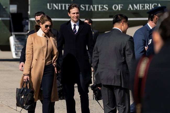 Counselor to the President Hope Hicks, left, with White House senior adviser Jared Kushner, walk from Marine One to accompany President Donald Trump aboard Air Force One as he departs Wednesday, Sept. 30, 2020, at Andrews Air Force Base, Md. (AP Photo/Alex Brandon)