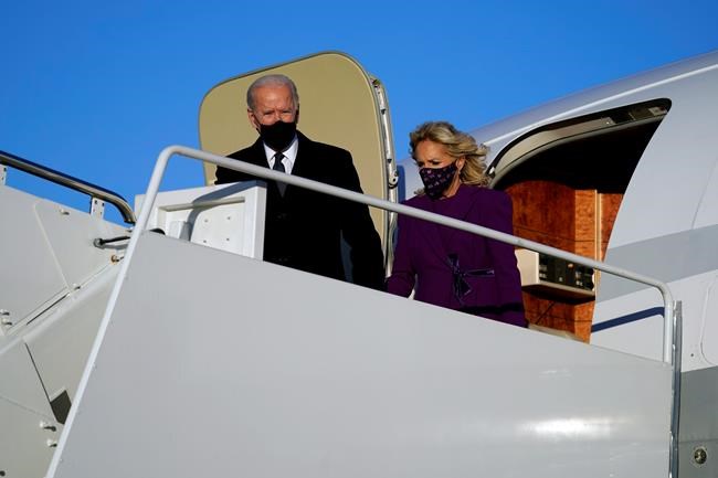 President-elect Joe Biden and his wife Jill Biden arrive at Andrews Air Force Base, Tuesday, Jan. 19, 2021, in Andrews Air Force Base, Md. (AP Photo/Evan Vucci)