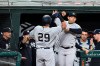 New York Yankees' Gio Urshela (29) is congratulated by Rougned Odor after hitting a three-run home run against the Baltimore Orioles during the third inning of a baseball game Wednesday, April 28, 2021, in Baltimore. (AP Photo/Gail Burton)
