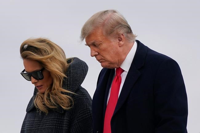 President Donald Trump and first lady Melania Trump step off Air Force One at Andrews Air Force Base, Md., Thursday, Dec. 31, 2020. Trump is returning to Washington after visiting his Mar-a-Lago resort. (AP Photo/Patrick Semansky)