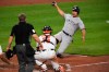 New York Yankees' Giancarlo Stanton slides but is tagged out by Baltimore Orioles catcher Chance Sisco during the third inning of a baseball game Tuesday, April 27, 2021, in Baltimore. (AP Photo/Terrance Williams)