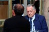 Lyon soccer club President Jean-Michel Aulas sits with his legal team in a cafe prior to a hearing at France's highest administrative court, the Council of State, in Paris, Thursday, June 4, 2020. Jean-Michel Aulas is asking French authorities to backpedal on their decision to end the football season prematurely amid the coronavirus pandemic. The men's league was canceled with 10 rounds remaining, Paris Saint-Germain declared champion, and Lyon finished outside the European places in seventh. (AP Photo/Michel Euler)