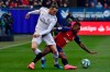 Real Madrid's Gareth Bale, left, vies for the ball with Osasuna's Pervis Estupinan during the Spanish La Liga soccer match between Osasuna and Real Madrid at El Sadar stadium in Pamplona, northern Spain, Sunday, Feb. 9, 2020. (AP Photo/Alvaro Barrientos)