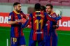Barcelona's Lionel Messi, right, celebrates after scoring his side's first goal with teammates during the Spanish La Liga soccer match between FC Barcelona and Huesca at the Camp Nou stadium in Barcelona, Spain, Monday, March 15, 2021. (AP Photo/Joan Monfort)