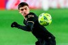 Barcelona's Pedri eyes the ball during the Spanish La Liga soccer match between Granada and FC Barcelona at the Los Carmenes stadium in Granada, Spain, Saturday, Jan. 9, 2021. (AP Photo/Jose Breton)