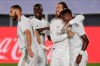 Real Madrid's Vinicius Junior, right, celebrates after scoring the opening goal with teammates during the Spanish La Liga soccer match between Real Madrid and Mallorca at Alfredo di Stefano stadium in Madrid, Spain, Wednesday, June 24, 2020. (AP Photo/Bernat Armangue)