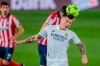 Real Madrid's Toni Kroos, right, heads for the ball with Atletico Madrid's Kieran Trippier during the Spanish La Liga soccer match between Real Madrid and Atletico Madrid at the Alfredo Di Stefano stadium in Madrid, Spain, Saturday, Dec. 12, 2020. (AP Photo/Bernat Armangue)
