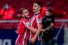 Atletico Madrid's Luis Suarez, right, celebrates after scoring a penalty kick with his teammate Atletico Madrid's Koke during the Spanish La Liga soccer match between Atletico Madrid and Athletic Bilbao at Wanda Metropolitano stadium in Madrid, Spain, Wednesday, March 10, 2021. (AP Photo/Bernat Armangue)