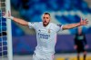 Real Madrid's Karim Benzema celebrates after scoring the opening goal during the Champions League group B soccer match between Real Madrid and Borussia Monchengladbach at the Alfredo Di Stefano stadium in Madrid, Spain, Wednesday, Dec. 9, 2020. (AP Photo/Bernat Armangue)