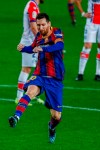 Barcelona's Lionel Messi celebrates after scoring his side's second goal during the Spanish La Liga soccer match between FC Barcelona and Alaves at the Camp Nou stadium in Barcelona, Spain, Saturday, Feb. 13, 2021. (AP Photo/Joan Monfort)