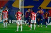 Barcelona's Ivan Rakitic, second right, celebrates with his teammate Lionel Messi after scoring the opening goal during the Spanish La Liga soccer match between FC Barcelona and Athletic Bilbao at the Camp Nou stadium in Barcelona, Spain, Tuesday, June 23, 2020. (AP Photo/Joan Monfort)