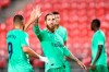 Real Madrid's Sergio Ramos, center, gestures with his teammate Benzema during the Spanish La Liga soccer match between Granada and Real Madrid at the Los Carmenes stadium in Granada, Spain, Monday, July 13, 2020. (AP Photo/Jose Breton)