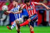 Atletico Madrid's Stefan Savic, right, vies for the ball with Alaves' Luis Rioja during the Spanish La Liga soccer match between Atletico Madrid and Alaves at the Wanda Metropolitano stadium in Madrid, Spain, Sunday, March 21, 2021. (AP Photo/Manu Fernandez)