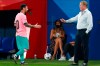 Barcelona's Lionel Messi, left, shakes hands as he is substituted with Barcelona's coach Ronald Koeman as he is substituted during the pre-season friendly soccer match between Barcelona and Girona at the Johan Cruyff Stadium in Barcelona, Spain, Wednesday, Sept. 16, 2020. (AP Photo/Joan Monfort)