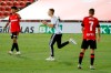A supporter invades the pitch, center, next to Mallorca's Kubo, left, during the Spanish La Liga soccer match between Mallorca and FC Barcelona at Son Moix Stadium in Palma de Mallorca, Spain, Saturday, June 13, 2020. With virtual crowds, daily matches and lots of testing for the coronavirus, soccer is coming back to Spain. The Spanish league resumes this week more than three months after it was suspended because of the COVID-19 pandemic. (AP Photo/Francisco Ubilla)