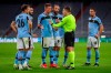 Lazio players argue with the referee during the Champions League, round of 16, second leg soccer match between FC Bayern Munich and Lazio at the soccer Arena stadium in Munich, Germany, Wednesday, March 17, 2021. (AP Photo/Matthias Schrader)
