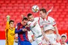 Barcelona's Antoine Griezmann, second left, fights for the ball with Sevilla's Youssef En-Nesyri, second right, during a Spanish Copa del Rey semifinal soccer match between Sevilla and FC Barcelona at Ramon Sanchez Pizjuan stadium in Seville , Spain, Wednesday, Feb. 10, 2021. (AP Photo/Angel Fernandez)