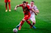 Belgium's Thorgan Hazard, left, vies for the ball with Belarus' Nikolai Signevich during a World Cup 2022 group E qualifying soccer match between Belgium and Belarus at the King Power stadium in Leuven, Belgium, Tuesday, March 30, 2021. (AP Photo/Francisco Seco)