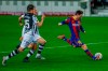 Barcelona's Lionel Messi, right, kicks for the ball to score his side's first goal during the Spanish La Liga soccer match between FC Barcelona and Levante at the Camp Nou stadium in Barcelona, Spain, Sunday, Dec. 13, 2020. (AP Photo/Joan Monfort)