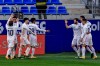 Real Madrid's Raphael Varane, second right, celebrates after scoring his side's second goal during the Spanish La Liga soccer match between Huesca and Real Madrid at El Alcoraz stadium in Huesca, Spain, Saturday, Feb. 6, 2021. (AP Photo/Alvaro Barrientos)