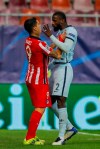 Atletico Madrid's Luis Suarez, left, argues with Chelsea's Antonio Rudiger during the Champions League, round of 16, first leg soccer match between Atletico Madrid and Chelsea at the National Arena stadium in Bucharest, Romania, Tuesday, Feb. 23, 2021. (AP Photo/Vadim Ghirda)