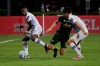 Orlando City midfielder Sebas Mendez (8) and defender Joao Moutinho (4), right, defend against Portland Timbers midfielder Diego Valeri (8), during the first half of an MLS soccer match, Tuesday, Aug. 11, 2020, in Kissimmee, Fla. (AP Photo/John Raoux)