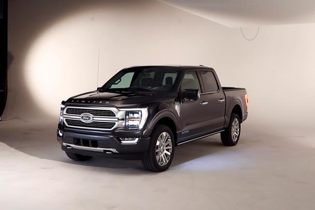 In a photo from, Wednesday, June 24, 2020, the new 2021 Ford F-150 truck is photographed in Ferndale, Mich. Six years ago, Ford bet big on the top-selling vehicle in America, rolling out a radical new version of the F-Series pickup with a lighter aluminum body instead of steel. Now it's time for another revamp, and Ford is playing it safe. On the outside, the truck changes little. The biggest differences are a gas-electric hybrid version, internet connectivity, and a revamped interior that turns the truck into more of a rolling office or even a place to nap. (AP Photo/Carlos Osorio)