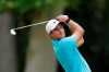Cameron Champ drives from the 11th tee during the first round of the Rocket Mortgage Classic golf tournament, Thursday, July 2, 2020, at the Detroit Golf Club in Detroit. Champ was cleared to join the field under a modified PGA Tour policy that allows players who test positive for the coronavirus to be eligible if they had no symptoms and get two negative test results at least 24 hours apart. (AP Photo/Carlos Osorio)