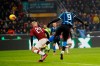 Inter Milan's Romelu Lukaku, right, scores his side's fourth goal during the Serie A soccer match between Inter Milan and AC Milan at the San Siro Stadium, in Milan, Italy, Sunday, Feb. 9, 2020. (AP Photo/Antonio Calanni)