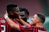 AC Milan's Rafael Leao, left, celebrates with his teammate Ismael Bennacer after scoring his side's 3rd goal during the Serie A soccer match between AC Milan and Juventus at the Milan San Siro Stadium, Italy, Tuesday, July 7, 2020. (Spada/LaPresse via AP)
