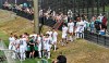 Borussia's team walks in front of their fans during the first training session of German Bundesliga club Borussia Moenchangladbach at the training ground in Moenchengladbach , Germany, Tuesday, Aug. 4, 2020. For the first time since the coronavirus outbreak, 300 supporters with face masks, online tickets and social distance were allowed to watch their team. (AP Photo/Martin Meissner)