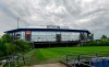 Rain clouds draw over the stadium Veltins Arena and the rolled out pitch of Bundesliga club FC Schalke 04 in Gelsenkirchen, Germany, Wednesday, April 29, 2020. Despite a ban in Germany on all large gatherings through the end of August to fight the coronavirus pandemic, soccer officials are hoping to restart the league without spectators in May. (AP Photo/Martin Meissner)
