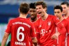 Bayern's Thomas Mueller, right, celebrates with teammates after scoring during the German Bundesliga soccer match between FC Schalke 04 and Bayern Munich in Gelsenkirchen, Germany, Sunday, Jan. 24, 2021. (AP Photo/Martin Meissner, Pool)