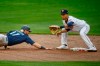 Minnesota Twins' Andrelton Simmons catches Seattle Mariners' Mitch Haniger off second base in the fifth inning of a baseball game Thursday, April 8, 2021, in Minneapolis. The Twins won 10-2. (AP Photo/Bruce Kluckhohn)