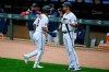 Minnesota Twins Luis Arraez, left, celebrates with Twins Alex Kirilloff after Arraez scores on a single by Twins Byron Buxton against the Pittsburgh Pirates during the first inning of a baseball game, Sunday, April 25, 2021, in Minneapolis. (AP Photo/Craig Lassig)