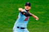 Minnesota Twins pitcher Rich Hill winds up during the first inning of the team's baseball game against the Milwaukee Brewers on Wednesday, Aug. 19, 2020, in Minneapolis. (AP Photo/Jim Mone)